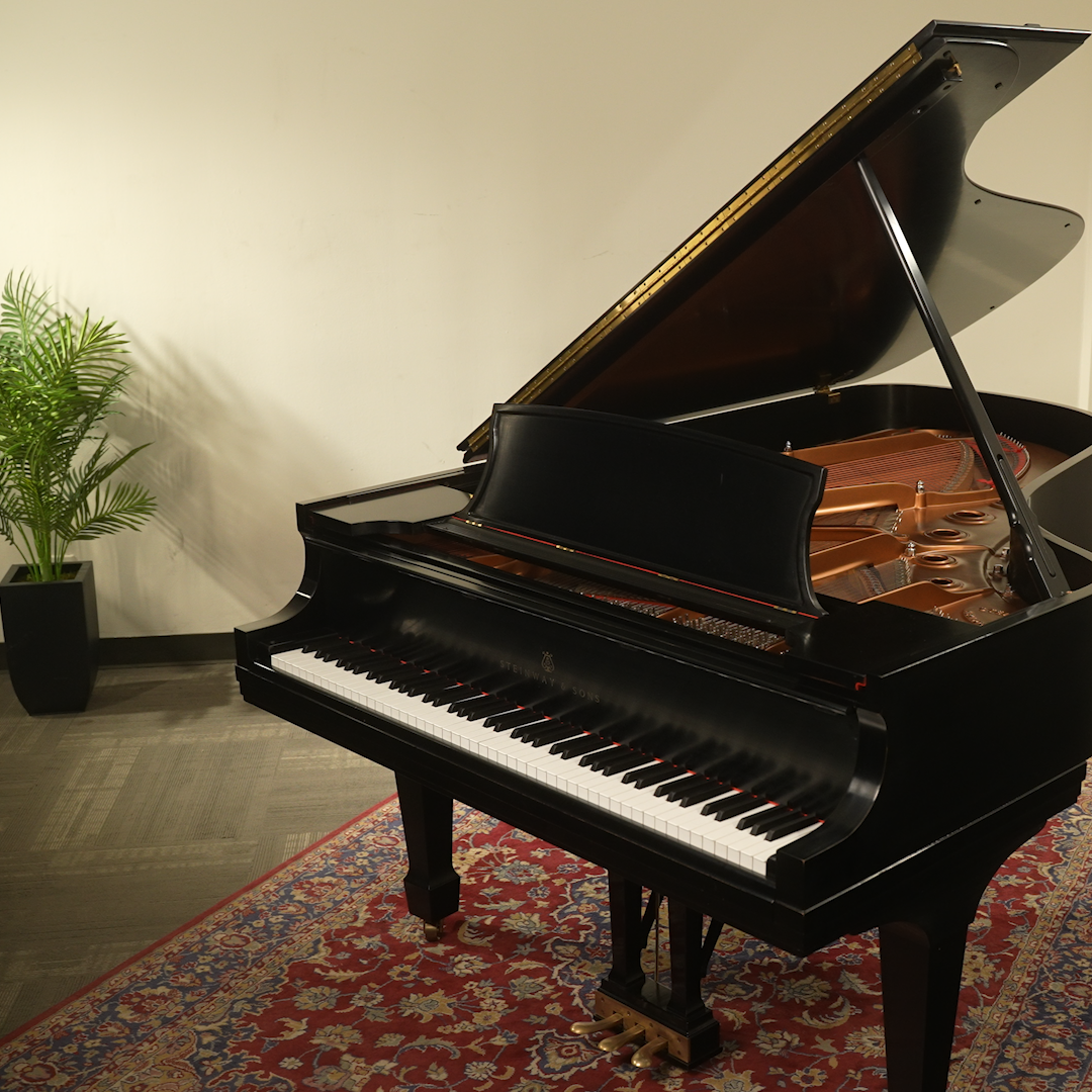 Grand Piano in white room